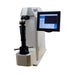 A white and black microhardness testing machine with a digital touch screen display, isolated on a white background.