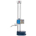 A digital height measuring device with two vertical silver metal rods, a blue and gray control box with a small LCD display, and a dark blue base, shown on a plain white background.
