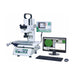 Microscope with digital display and computer setup on a white background